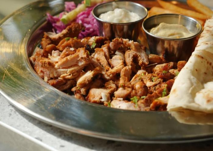 Chicken shawarma plate with fries and dips